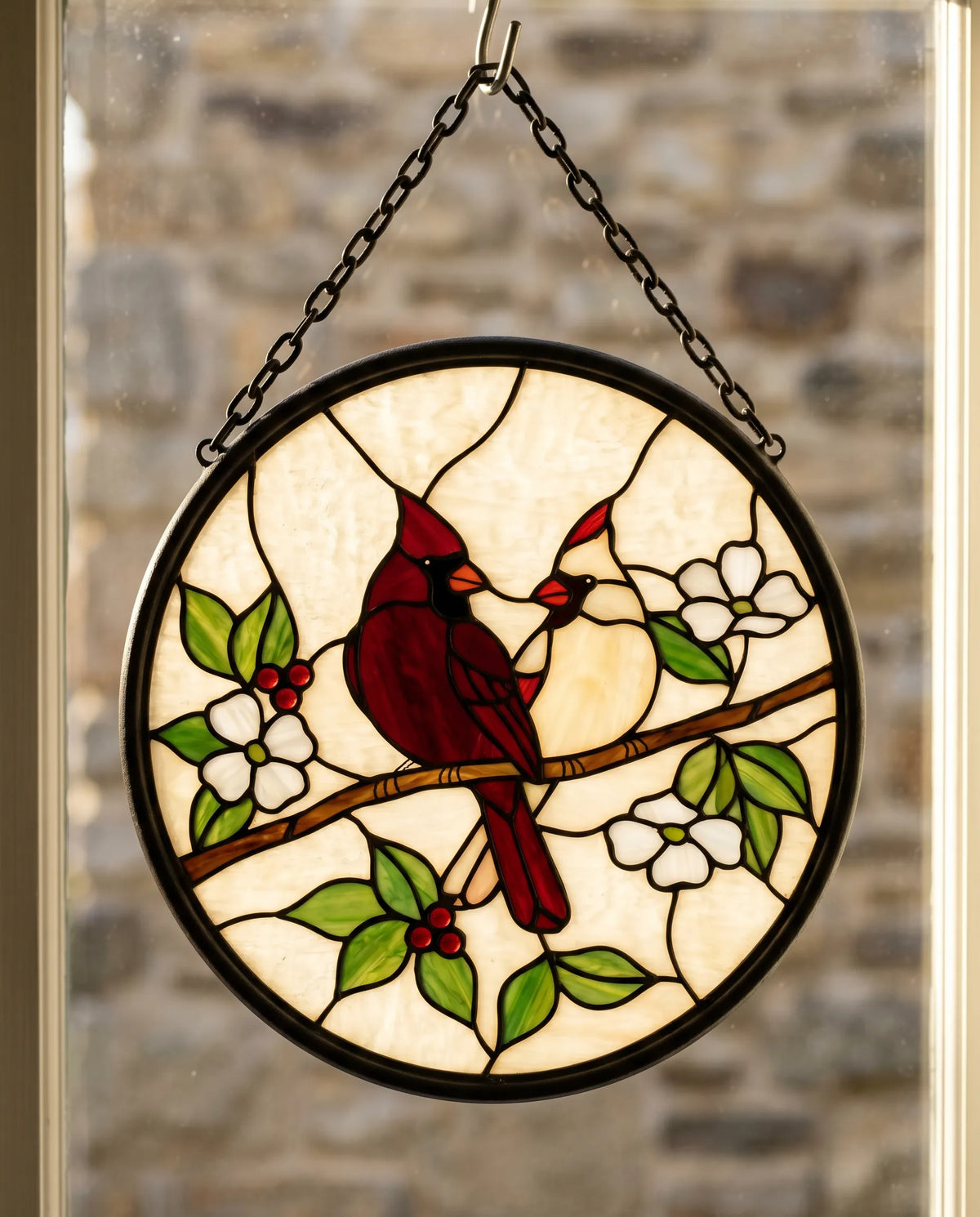 Walter's cardinal-pair leaded-glass panel hanging in a sunlit window